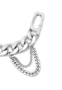 Silver chain bracelet featuring large, interlocking links and a smaller chain dangling from one side; includes a unique clasp design.