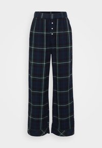 Navy ruudulliset leveät housut, joissa on valko-vihreä ruutukuosi, joustava vyötärö ja etunapitus. Pehmeä kangas, jossa on sileä rakenne.