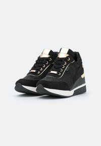 xti grey trainers