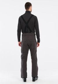 Graue wasserdichte Skihose mit verstellbaren schwarzen Trägern, seitlichen Reißverschlussbelüftungen und seitlichen Taschen. Glattes, strapazierfähiges Material und taillierte Passform.
