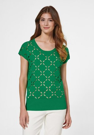 Groene gebreide top met een ronde hals, korte mouwen en uitgesneden diamantpatronen. Getextureerde zoom met ribbels aan de onderkant.