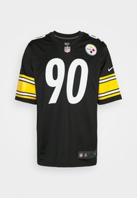 Maillot de football noir avec le numéro 90 en blanc, des manches à rayures jaunes et noires, un patch du logo NFL, et un emblème "Steelers" sur la poitrine.