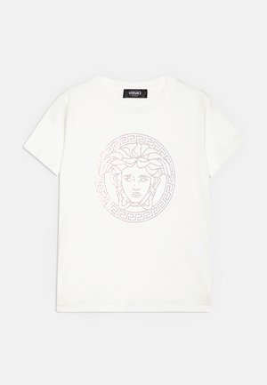 White cotton t-shirt featuring a Medusa logo in iridescent dots surrounded by a Greek key pattern. Short sleeves and crew neck design.