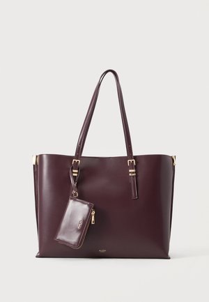 Dunkelbraune Ledertasche mit zwei Schulterriemen und passendem, befestigtem Reißverschluss-Etui vor hellem, einfarbigem Hintergrund.