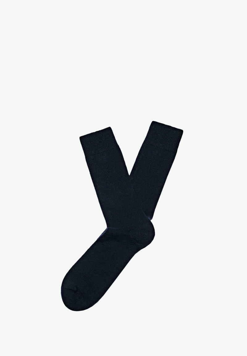 Calzini alla caviglia di un blu navy scuro realizzati in un morbido tessuto a maglia con una superficie liscia e bordi a costine, privi di motivi o elementi decorativi.