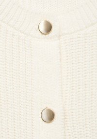 Knitted white cardigan featuring a textured pattern and two metallic round buttons at the front. Soft, chunky fabric with ribbed edges.