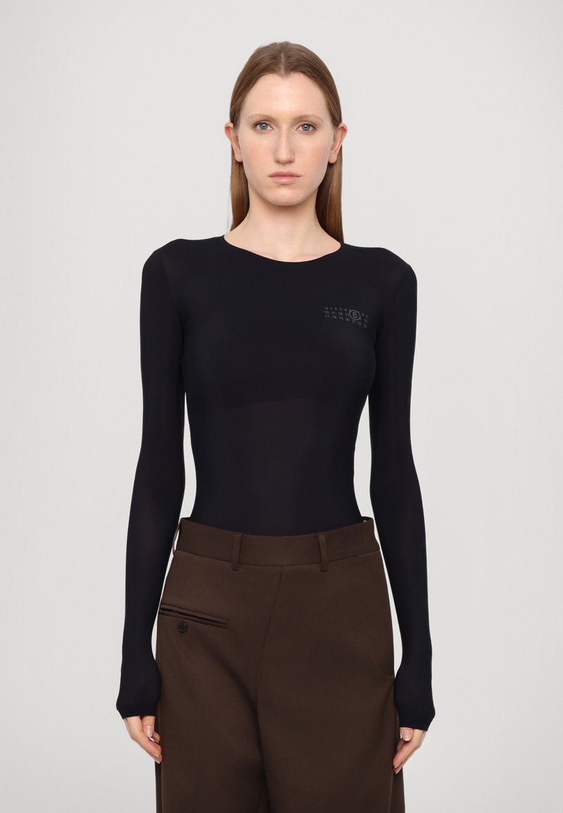 Black long-sleeve bodysuit with a fitted design and round neckline, featuring subtle graphic detailing on the chest.