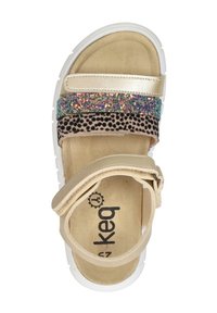 Sandals with a beige faux leather upper, featuring a shimmering multi-colored strap, a leopard print band, and a white rubber sole.