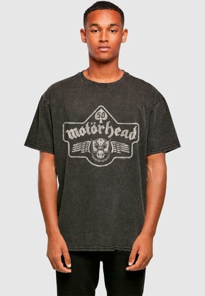 Black cotton t-shirt with short sleeves, featuring a faded Motorhead logo and graphic print in white on the front, round neck design.