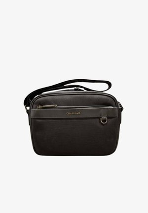 Sac bandoulière noir compact avec tissu texturé, poche zippée à l'avant, sangle réglable et petit anneau en D en métal sur le panneau avant.