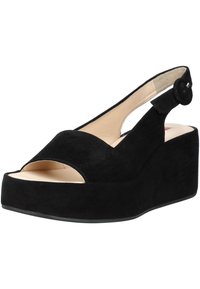 Sandalo con zeppa piattaforma in suède nero, con punta aperta e cinturino slingback, caratterizzato da un' accentatura a pulsante rotondo vicino alla caviglia. Fodera interna liscia.