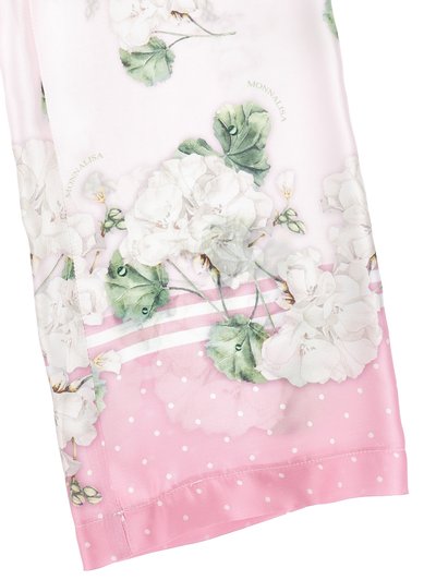 Ροζ ύφασμα με άσπρα λουλούδια και πράσινα φύλλα, διακοσμημένο με μικρές άσπρες πουά και λεπτές ριγέ λεπτομέρειες.