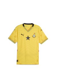 Žltý športový dres s krátkymi rukávmi, čiernym V-výstrihom, s dizajnom hviezd, vyšitým logom a dekoratívnymi vzormi v jemnej textúre.