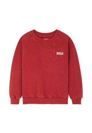 Red sweatshirt with a crew neck, raglan sleeves, and ribbed cuffs. Features "AMERICAN VINTAGE" logo on the chest in white. Cotton material.