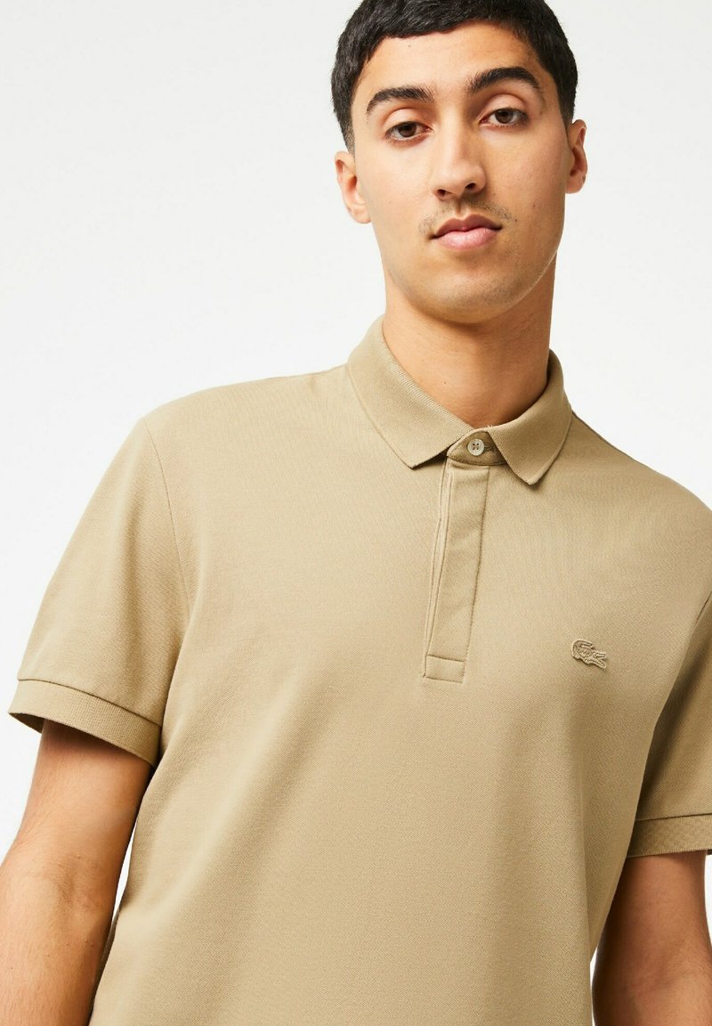 beige lacoste polo
