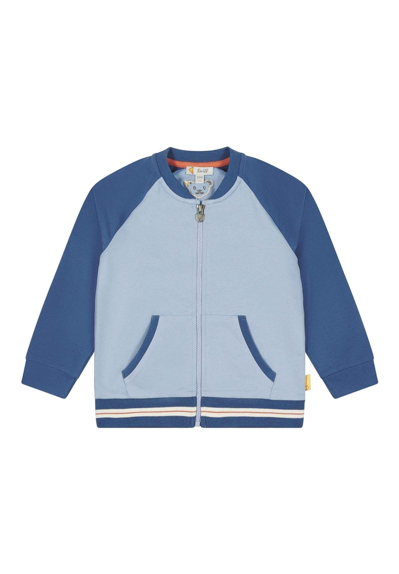 Lyseblå og marineblå zip-up børnejakke med lange ærmer, frontlommer og en stribet kant.