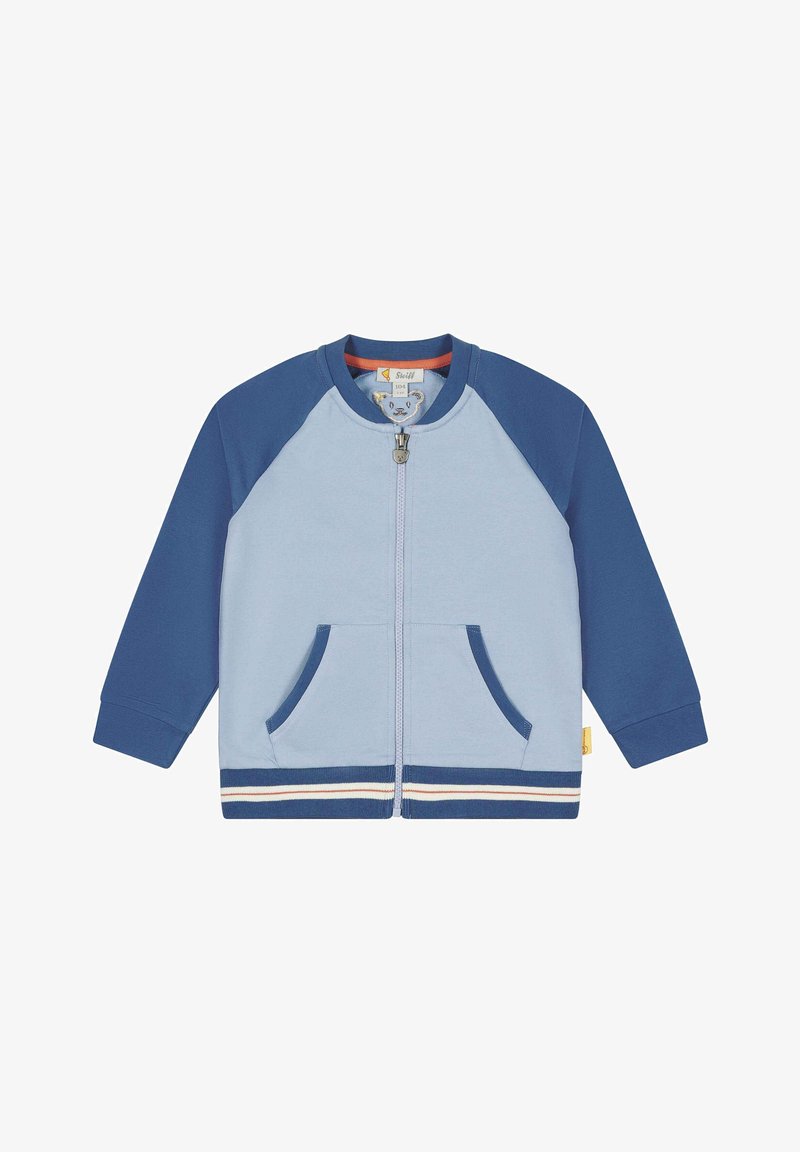 Lyseblå og marineblå zip-up børnejakke med lange ærmer, frontlommer og en stribet kant.
