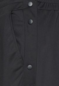 YOURTURN ADAPT RETRO JOGGER - Treniņtērpa apakšdaļas - black