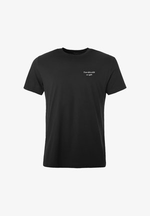 T-shirt noir à manches courtes avec texte blanc « Freu dich nicht zu spät » sur la poitrine gauche, centré sur un fond blanc.