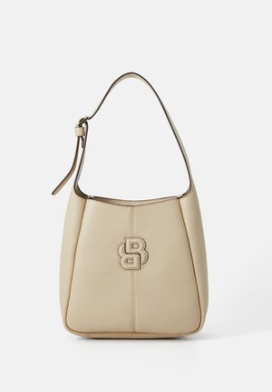 Beige leather handbag with a textured surface, a narrow shoulder strap, and a prominent embossed logo on the front.