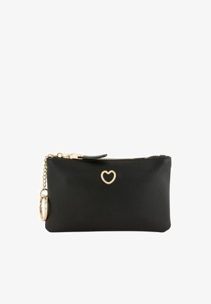 Black textured wristlet with gold heart emblem, gold zipper, and attached gold keychain ring on white background.