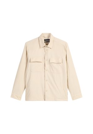 Camicia a maniche lunghe beige in tessuto morbido con scollo a collo, due tasche sul petto e chiusura con bottoni. Presenta un design dal taglio comodo.