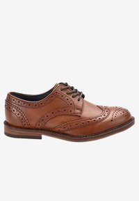 Brown leather brogue shoe with detailed perforations, a rounded toe, lace-up design, and a wooden sole. Smooth texture throughout.