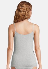 Gray camisole with thin adjustable straps, made from soft, smooth fabric. Features a rounded neckline and a fitted design.