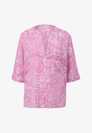 Blusa di lino rosa con maniche corte, caratterizzata da un collo a V, tasca frontale e motivo floreale bianco su tutto il tessuto.