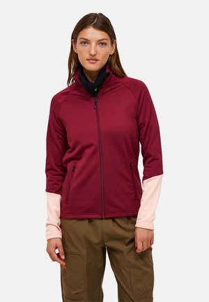 Burgundy zip-jakke med pink accenter og sidelommer, lavet af et blødt stof; har en høj krave og en tætsiddende design.