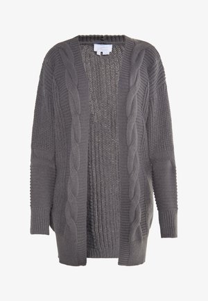 Harmaa auki oleva kardigan, joka on valmistettu neulotusta kankaasta. Koulu neule yksityiskohtien, ribattu hihansuut ja teksturoitu sisus. Rentoa ja ylisuurta muotoilua.