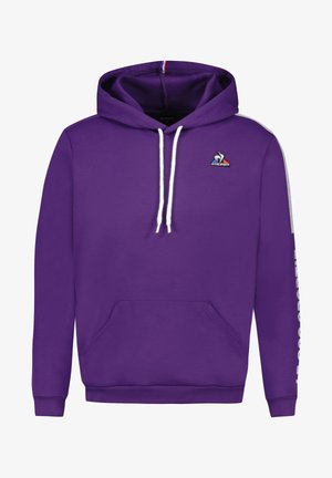 Haut à capuche violet en mélange de coton, avec une poche kangourou à l'avant, des cordons blancs, et un logo sur la poitrine avec du texte blanc sur les manches.