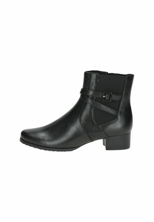 Black leather ankle boot with a textured panel, slim ankle strap with a buckle, and a low block heel. Smooth finish and pointed toe design.