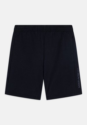 Tamsiai mėlynos sportinės šortai su elastinga juosta, šoniniais kišenėmis ir logotipu spausdintu ant kairiojo šlaunies. Minkšta, lengva medžiaga.