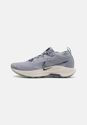 Light grey running shoe with a textured mesh upper, dark blue accents, and a cushioned sole featuring green rubber tread for traction.