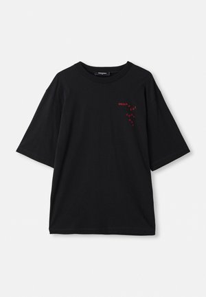 Black short-sleeve t-shirt made of cotton. Features a red graphic print on the left chest, with “DSQUARED2” and “COOL GUY” text.