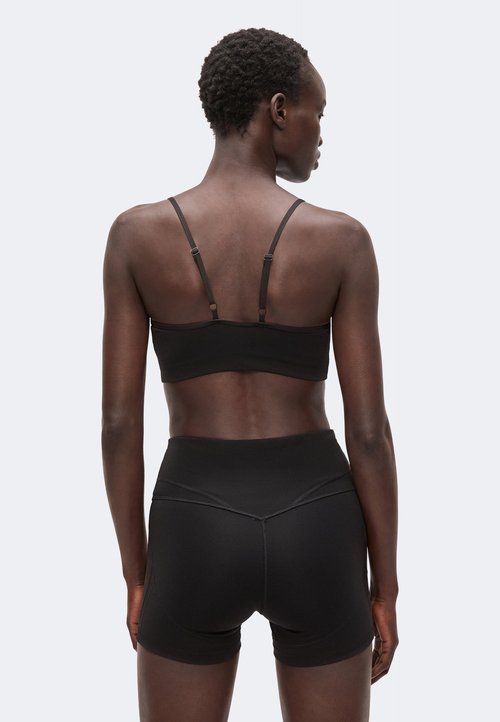 PUMA MOVE BRA LOW - Light support sports bra - black — photo 3