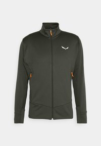 Slim-fit black jacket with high collar, full zipper, and orange zipper pull. Features zip pockets and a white logo on the chest.