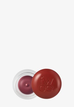 Récipient rond transparent avec un maquillage crème mauve et un couvercle marron fermé embossé de "fwee" sur fond blanc.
