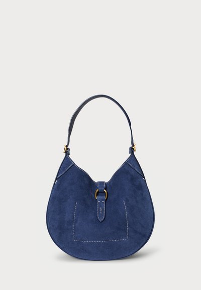 Navy suede hobo bag with a curved shape, a top handle, and contrasting white stitching. Features a gold-tone hardware accent at the closure.