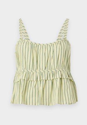 Haut jaune sans manches avec de fines rayures verticales sombres, buste froncé, détail taille péplum et larges bretelles.