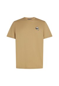 Beige katoenen t-shirt met een ronde halslijn en korte mouwen. Heeft een klein zwart-wit logo op de linker borst.