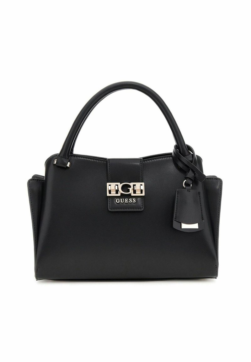 Sac à main en cuir noir avec une forme structurée, des poignées supérieures, des finitions en métal argenté et une petite étiquette attachée. Présente un logo bien en vue.