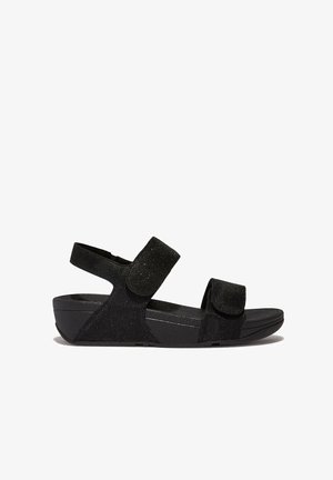 Sandales noires avec sangles en velcro réglables, tissu texturé et semelle rembourrée. Caractéristiques d'un design à talon bas pour le confort et la stabilité.