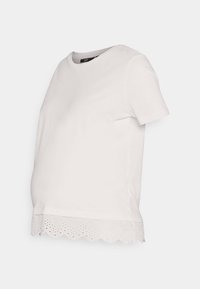 T-shirt de maternidade em algodão branco com decote redondo e bainha escavada com detalhes de ilhós na parte inferior. Corte solto para conforto.