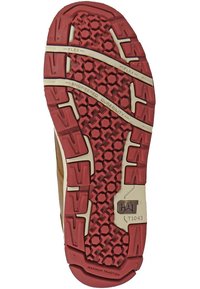 Suola in gomma con una combinazione di colori rosso e beige, caratterizzata da modelli di battistrada esagonali e multidirezionali per trazione e flessibilità.