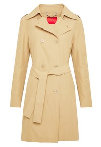 Gabardina beige con botones de doble botonadura, cintura con cinturón y un cuello afilado. Tejido suave con una silueta entallada y costuras visibles.