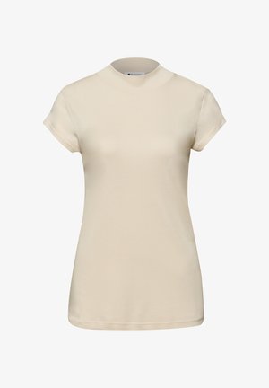 Maglietta aderente beige a maniche corte con collo alla coreana, tessuto liscio e design semplice, mostrata su uno sfondo bianco.