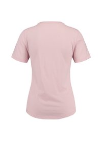 T-shirt rose à manches courtes, en tissu doux, avec un col rond et une coupe ajustée. Texture lisse sans motifs ni accents visibles.
