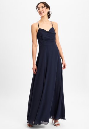 Marineblauwe maxi-jurk met een sweetheart-halslijn, geraffineerde romp en verstelbare spaghettibandjes; zacht, vloeiend stof.